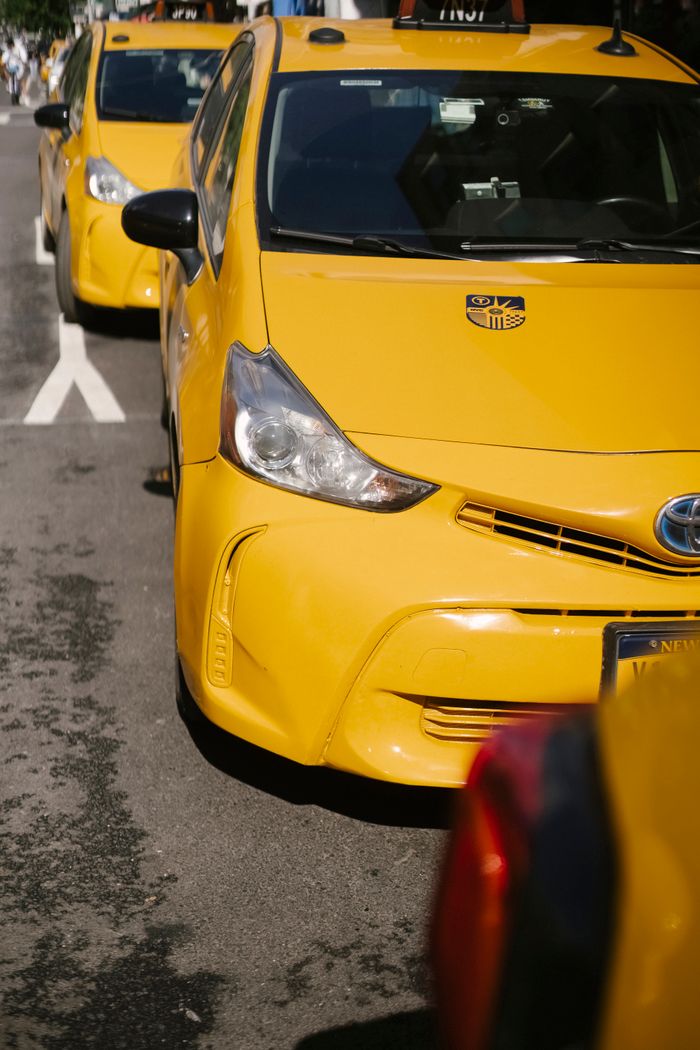 Mastering the First Impression: Your intriguing post title goes here From above of bright yellow modern sports cab cars parked on urban roadway in sunlight